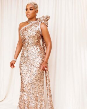 Tiffany Haddish Instagram - I don’t know about you, but tonight I feel like a Gift! I am so excited to share with the real ones! 😘 #grammys @waymanandmicah @hair4kicks @kilprity custom @prada @normansilverman  @mr_dadams #sheready #diswhatmoneylooklike #diswhatfamelooklike #diswhatsuccesslooklike