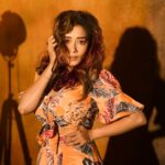 Tina Datta Instagram - A little orange, a little hues 🧡 it’s the weekend, so there can’t be any blues🥳 It’s fun playing the enchanting game of lights and shadows, where darkness embraces illumination, where every moment unveils a captivating dance of contrasts, casting a spell of intrigue and mystique✨ . . #lookbook #fashion #style #instadaily #instagood #TinaKaStyle #tinadatta