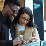 Tobi Bakre Instagram - My padi and I @tobibakre had a taste of luxury with @british_airways A time was had. The journey was so enjoyable, thanks to the incredible full course meal, the personal entertainment system that had tons of shows and movies to pick from (did I mention the noise canceling headphones), the large overhead baggage space was amazing (no worries about if there'll be enough space for your hand luggage) and the world class hospitality at the arrival lounge. As you can see, I travelled like royalty. My heart and tummy were full (you guys know I don't play with food!!!). Don't say I don't share any secrets with you. Travel with British airways to unlock style and comfort. Thank me later, and you're welcome in advance! 🤪 #BritishAirways #sponsored