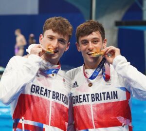 Tom Daley Instagram - 🥇 OLYMPIC CHAMPIONS! 🥇 
•
•
I still can’t believe we actually did it! After 4 Olympics and 20 years of diving! An Olympic Gold medal! And to do it with @mattydiver was all the more special! I wish my family was there to see it, but knowing my Husband and Son got to see us (📺) win Olympic Gold is NEXT LEVEL! 🥇🔥🇯🇵🇬🇧
•
•
Massive thank you to everyone who made this possible! You have all played such a huge role in making this happen! 
•
•
#tokyo #tokyo2020 #olympics #olympicchampion