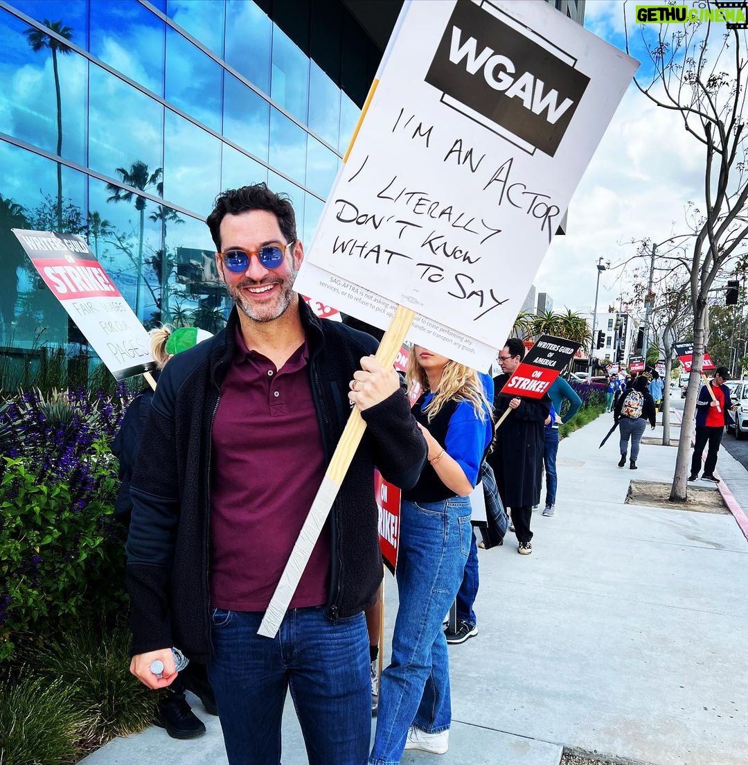 Tom Ellis - 686.2K Likes - Spent today Marching in solidarity with my #WGA friends, family and colleagues. Writers are inventors they should be paid as such. Without them we are nothing #wgastrong ✊🏼