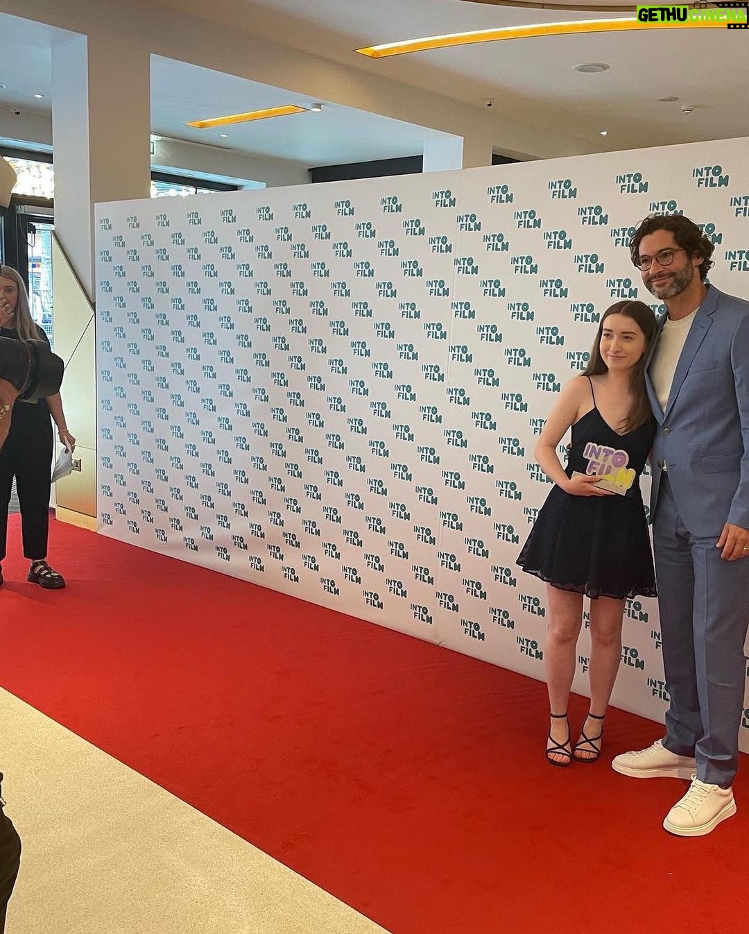 Tom Ellis Instagram - What a privilege to be invited to present at the #intofilmawards this week. I was blown away by the talent on show and was very happy that Zoe won the award for best animation 12 and over for her incredibly moving short ‘Mia’ The future of British film making is looking very bright indeed. ❤️ Thanks to @boss and @gracegilfeather for the dapper look and @samcmakeup for taming the curls #intofilm