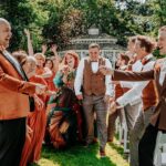 Tom Fletcher Instagram - I’ve not had a chance to properly write about this yet but in the middle of the summer, on the most glorious of summery days, my sister @carriehopefletcher married @joelmontague10. It was a perfect day. I had the terrifying honour of singing (and sobbing) while our three boys walked Carrie down the aisle (with bubble guns 🥴🤣) and the whole day was the most awesome, musical-theatre-sprinkled wedding of autumnal Disney dreams, complete with a SUNG grooms speech…I mean, who even does that @joelmontague10 😜. Anyway, I know a bit of time has gone but I just wanted to say the day was the best and I love you both.