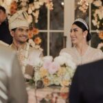 Tyas Mirasih Instagram – After all.. Soulmates always end up together đź’Ť
Well Organized by : @adara.wedding
Venue @themanorandara
Photography & Videography : @morden.co @samuelrustandy @bychandrasusanto
Decoration & Tents : @classytentdecoration
Carpets : @farahcarpetsofficial
Lighting : @uplightpro
Make Up : @hepidavid
Hair Do : @tominjoo
Bride’s Attire for Akad Nikah & Reception : @svarna_byikatindonesia @didietmaulana
Bride’s Crown & Headpiece @rinaldyyunardi
Jewelry : @adellejewellery
Bride’s Wedding Shoes : @regisbridalshoes
Bride’s robe : @lucette_essie
Bride’s Nail art : @kookoo.nails
Groom’s Attire for Akad Nikah & Reception : @svarna_byikatindonesia @didietmaulana
Bride and Groom textile : @the.designerworkshop
Groom’s Hairstylist : @aryadillah_27
Wedding Ring : @adellejewellery
Akad Catering :
@teppanku
@baksobuetu
@gococo.indonesia
@ponut.id
@papo_id
@cantikaputricake
Reception Catering : @themanor.cafe
Akad Souvenir : @howelandco
Reception Souvenir : @redribbongift @drzlim_official
Digital Invitation & Live streaming : @viding.co
Mahar & Ring box : @jingga_seserahanmahar
Bouquets : @faveur.florist
Wedding Cake : @sweetsalt_id
Birthday Cake : @RRCakes
Entertainment : @aqisinggih
Sound system : @deoentertainment
MC Akad & Reception : @andrakarna
Usher : @beauty_usher
Photobooth : @theholograil
Gift :
@farahcarpetsofficial
@bardismarthome
Projector & screen : @vidiavideo
#TEZIapbahagiainTYAS The Manor Andara