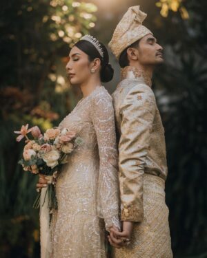 Tyas Mirasih Instagram - Hand in hand. You & me.
Today, tomorrow,forever 💍

Well Organized by : @adara.wedding 
Venue @themanorandara
Photography & Videography : @morden.co @samuelrustandy @bychandrasusanto
Decoration & Tents : @classytentdecoration 
Carpets : @farahcarpetsofficial
Lighting : @uplightpro 
Make Up : @hepidavid 
Hair Do : @tominjoo 
Bride's Attire for Akad Nikah &  Reception : @svarna_byikatindonesia @didietmaulana 
Bride’s Crown & Headpiece @rinaldyyunardi 
Jewelry : @adellejewellery
Bride's Wedding Shoes : @regisbridalshoes 
Bride's robe : @lucette_essie
Bride's Nail art : @kookoo.nails 
Groom's Attire for Akad Nikah &  Reception : @svarna_byikatindonesia @didietmaulana
Bride and Groom textile : @the.designerworkshop
Groom's Hairstylist : @aryadillah_27
Mother Makeup : @wulanwidianto
Sister Makeup :
@bonitaelisabeth.makeup @belovedbyhepidavid
Wedding Ring :  @adellejewellery 
Akad Catering : 
@teppanku 
@baksobuetu 
@gococo.indonesia 
@ponut.id 
@papo_id
@cantikaputricake
Reception Catering : @themanor.cafe
Akad Souvenir : @howelandco 
Reception Souvenir : @redribbongift @drzlim_official
Digital Invitation & Live streaming : @viding.co 
Mahar & Ring box : @jingga_seserahanmahar 
Bouquets : @faveur.florist 
Wedding Cake : @sweetsalt_id 
Birthday Cake : @RRCakes
Entertainment : @aqisinggih 
Sound system : @deoentertainmentindonesia
MC Akad & Reception :  @andrakarna
Usher : @beauty_usher
Photobooth : @theholograil 
Gift : @farahcarpetsofficial
@bardismarthome

#TEZIapbahagiainTYAS