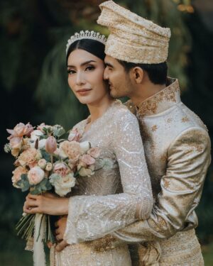Tyas Mirasih Instagram - Hand in hand. You & me.
Today, tomorrow,forever 💍

Well Organized by : @adara.wedding 
Venue @themanorandara
Photography & Videography : @morden.co @samuelrustandy @bychandrasusanto
Decoration & Tents : @classytentdecoration 
Carpets : @farahcarpetsofficial
Lighting : @uplightpro 
Make Up : @hepidavid 
Hair Do : @tominjoo 
Bride's Attire for Akad Nikah &  Reception : @svarna_byikatindonesia @didietmaulana 
Bride’s Crown & Headpiece @rinaldyyunardi 
Jewelry : @adellejewellery
Bride's Wedding Shoes : @regisbridalshoes 
Bride's robe : @lucette_essie
Bride's Nail art : @kookoo.nails 
Groom's Attire for Akad Nikah &  Reception : @svarna_byikatindonesia @didietmaulana
Bride and Groom textile : @the.designerworkshop
Groom's Hairstylist : @aryadillah_27
Mother Makeup : @wulanwidianto
Sister Makeup :
@bonitaelisabeth.makeup @belovedbyhepidavid
Wedding Ring :  @adellejewellery 
Akad Catering : 
@teppanku 
@baksobuetu 
@gococo.indonesia 
@ponut.id 
@papo_id
@cantikaputricake
Reception Catering : @themanor.cafe
Akad Souvenir : @howelandco 
Reception Souvenir : @redribbongift @drzlim_official
Digital Invitation & Live streaming : @viding.co 
Mahar & Ring box : @jingga_seserahanmahar 
Bouquets : @faveur.florist 
Wedding Cake : @sweetsalt_id 
Birthday Cake : @RRCakes
Entertainment : @aqisinggih 
Sound system : @deoentertainmentindonesia
MC Akad & Reception :  @andrakarna
Usher : @beauty_usher
Photobooth : @theholograil 
Gift : @farahcarpetsofficial
@bardismarthome

#TEZIapbahagiainTYAS