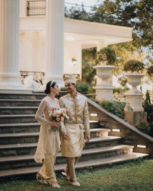 Tyas Mirasih Instagram - Hand in hand. You & me.
Today, tomorrow,forever 💍

Well Organized by : @adara.wedding 
Venue @themanorandara
Photography & Videography : @morden.co @samuelrustandy @bychandrasusanto
Decoration & Tents : @classytentdecoration 
Carpets : @farahcarpetsofficial
Lighting : @uplightpro 
Make Up : @hepidavid 
Hair Do : @tominjoo 
Bride's Attire for Akad Nikah &  Reception : @svarna_byikatindonesia @didietmaulana 
Bride’s Crown & Headpiece @rinaldyyunardi 
Jewelry : @adellejewellery
Bride's Wedding Shoes : @regisbridalshoes 
Bride's robe : @lucette_essie
Bride's Nail art : @kookoo.nails 
Groom's Attire for Akad Nikah &  Reception : @svarna_byikatindonesia @didietmaulana
Bride and Groom textile : @the.designerworkshop
Groom's Hairstylist : @aryadillah_27
Mother Makeup : @wulanwidianto
Sister Makeup :
@bonitaelisabeth.makeup @belovedbyhepidavid
Wedding Ring :  @adellejewellery 
Akad Catering : 
@teppanku 
@baksobuetu 
@gococo.indonesia 
@ponut.id 
@papo_id
@cantikaputricake
Reception Catering : @themanor.cafe
Akad Souvenir : @howelandco 
Reception Souvenir : @redribbongift @drzlim_official
Digital Invitation & Live streaming : @viding.co 
Mahar & Ring box : @jingga_seserahanmahar 
Bouquets : @faveur.florist 
Wedding Cake : @sweetsalt_id 
Birthday Cake : @RRCakes
Entertainment : @aqisinggih 
Sound system : @deoentertainmentindonesia
MC Akad & Reception :  @andrakarna
Usher : @beauty_usher
Photobooth : @theholograil 
Gift : @farahcarpetsofficial
@bardismarthome

#TEZIapbahagiainTYAS