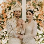 Tyas Mirasih Instagram – No longer two but one đź’Ť
Well Organized by : @adara.wedding
Venue @themanorandara
Photography & Videography : @morden.co @samuelrustandy @bychandrasusanto
Decoration & Tents : @classytentdecoration
Carpets : @farahcarpetsofficial
Lighting : @uplightpro
Make Up : @hepidavid
Hair Do : @tominjoo
Bride’s Attire for Akad Nikah & Reception : @svarna_byikatindonesia @didietmaulana
Bride’s Crown & Headpiece @rinaldyyunardi
Jewelry : @adellejewellery
Bride’s Wedding Shoes : @regisbridalshoes
Bride’s robe : @lucette_essie
Bride’s Nail art : @kookoo.nails
Groom’s Attire for Akad Nikah & Reception : @svarna_byikatindonesia @didietmaulana
Bride and Groom textile : @the.designerworkshop
Groom’s Hairstylist : @aryadillah_27
Mother Makeup : @wulanwidianto
Sister Makeup :
@bonitaelisabeth.makeup @belovedbyhepidavid
Wedding Ring : @adellejewellery
Akad Catering :
@teppanku
@baksobuetu
@gococo.indonesia
@ponut.id
@papo_id
@cantikaputricake
Reception Catering : @themanor.cafe
Akad Souvenir : @howelandco
Reception Souvenir : @redribbongift @drzlim_official
Digital Invitation & Live streaming : @viding.co
Mahar & Ring box : @jingga_seserahanmahar
Bouquets : @faveur.florist
Wedding Cake : @sweetsalt_id
Birthday Cake : @RRCakes
Entertainment : @aqisinggih
Sound system : @deoentertainmentindonesia
MC Akad & Reception : @andrakarna
Usher : @beauty_usher
Photobooth : @theholograil
Gift : @farahcarpetsofficial
@bardismarthome
#TEZIapbahagiainTYAS The Manor Andara