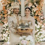 Tyas Mirasih Instagram – No longer two but one đź’Ť
Well Organized by : @adara.wedding
Venue @themanorandara
Photography & Videography : @morden.co @samuelrustandy @bychandrasusanto
Decoration & Tents : @classytentdecoration
Carpets : @farahcarpetsofficial
Lighting : @uplightpro
Make Up : @hepidavid
Hair Do : @tominjoo
Bride’s Attire for Akad Nikah & Reception : @svarna_byikatindonesia @didietmaulana
Bride’s Crown & Headpiece @rinaldyyunardi
Jewelry : @adellejewellery
Bride’s Wedding Shoes : @regisbridalshoes
Bride’s robe : @lucette_essie
Bride’s Nail art : @kookoo.nails
Groom’s Attire for Akad Nikah & Reception : @svarna_byikatindonesia @didietmaulana
Bride and Groom textile : @the.designerworkshop
Groom’s Hairstylist : @aryadillah_27
Mother Makeup : @wulanwidianto
Sister Makeup :
@bonitaelisabeth.makeup @belovedbyhepidavid
Wedding Ring : @adellejewellery
Akad Catering :
@teppanku
@baksobuetu
@gococo.indonesia
@ponut.id
@papo_id
@cantikaputricake
Reception Catering : @themanor.cafe
Akad Souvenir : @howelandco
Reception Souvenir : @redribbongift @drzlim_official
Digital Invitation & Live streaming : @viding.co
Mahar & Ring box : @jingga_seserahanmahar
Bouquets : @faveur.florist
Wedding Cake : @sweetsalt_id
Birthday Cake : @RRCakes
Entertainment : @aqisinggih
Sound system : @deoentertainmentindonesia
MC Akad & Reception : @andrakarna
Usher : @beauty_usher
Photobooth : @theholograil
Gift : @farahcarpetsofficial
@bardismarthome
#TEZIapbahagiainTYAS The Manor Andara