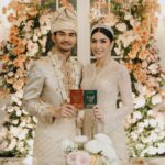 Tyas Mirasih Instagram – No longer two but one 💍

Well Organized by : @adara.wedding 
Venue @themanorandara
Photography & Videography : @morden.co @samuelrustandy @bychandrasusanto
Decoration & Tents : @classytentdecoration 
Carpets : @farahcarpetsofficial
Lighting : @uplightpro 
Make Up : @hepidavid 
Hair Do : @tominjoo 
Bride’s Attire for Akad Nikah &  Reception : @svarna_byikatindonesia @didietmaulana 
Bride’s Crown & Headpiece @rinaldyyunardi 
Jewelry : @adellejewellery
Bride’s Wedding Shoes : @regisbridalshoes 
Bride’s robe : @lucette_essie
Bride’s Nail art : @kookoo.nails 
Groom’s Attire for Akad Nikah &  Reception : @svarna_byikatindonesia @didietmaulana
Bride and Groom textile : @the.designerworkshop
Groom’s Hairstylist : @aryadillah_27
Mother Makeup : @wulanwidianto
Sister Makeup :
@bonitaelisabeth.makeup @belovedbyhepidavid
Wedding Ring :  @adellejewellery 
Akad Catering : 
@teppanku 
@baksobuetu 
@gococo.indonesia 
@ponut.id 
@papo_id
@cantikaputricake
Reception Catering : @themanor.cafe
Akad Souvenir : @howelandco 
Reception Souvenir : @redribbongift @drzlim_official
Digital Invitation & Live streaming : @viding.co 
Mahar & Ring box : @jingga_seserahanmahar 
Bouquets : @faveur.florist 
Wedding Cake : @sweetsalt_id 
Birthday Cake : @RRCakes
Entertainment : @aqisinggih 
Sound system : @deoentertainmentindonesia
MC Akad & Reception :  @andrakarna
Usher : @beauty_usher
Photobooth : @theholograil 
Gift : @farahcarpetsofficial
@bardismarthome

#TEZIapbahagiainTYAS The Manor Andara