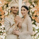Tyas Mirasih Instagram – No longer two but one đź’Ť
Well Organized by : @adara.wedding
Venue @themanorandara
Photography & Videography : @morden.co @samuelrustandy @bychandrasusanto
Decoration & Tents : @classytentdecoration
Carpets : @farahcarpetsofficial
Lighting : @uplightpro
Make Up : @hepidavid
Hair Do : @tominjoo
Bride’s Attire for Akad Nikah & Reception : @svarna_byikatindonesia @didietmaulana
Bride’s Crown & Headpiece @rinaldyyunardi
Jewelry : @adellejewellery
Bride’s Wedding Shoes : @regisbridalshoes
Bride’s robe : @lucette_essie
Bride’s Nail art : @kookoo.nails
Groom’s Attire for Akad Nikah & Reception : @svarna_byikatindonesia @didietmaulana
Bride and Groom textile : @the.designerworkshop
Groom’s Hairstylist : @aryadillah_27
Mother Makeup : @wulanwidianto
Sister Makeup :
@bonitaelisabeth.makeup @belovedbyhepidavid
Wedding Ring : @adellejewellery
Akad Catering :
@teppanku
@baksobuetu
@gococo.indonesia
@ponut.id
@papo_id
@cantikaputricake
Reception Catering : @themanor.cafe
Akad Souvenir : @howelandco
Reception Souvenir : @redribbongift @drzlim_official
Digital Invitation & Live streaming : @viding.co
Mahar & Ring box : @jingga_seserahanmahar
Bouquets : @faveur.florist
Wedding Cake : @sweetsalt_id
Birthday Cake : @RRCakes
Entertainment : @aqisinggih
Sound system : @deoentertainmentindonesia
MC Akad & Reception : @andrakarna
Usher : @beauty_usher
Photobooth : @theholograil
Gift : @farahcarpetsofficial
@bardismarthome
#TEZIapbahagiainTYAS The Manor Andara