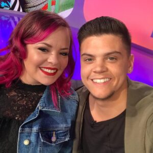 Tyler Baltierra Instagram - HAPPY 30th BIRTHDAY to the most amazing woman, mother & wife. I love you more than I could ever express with words…but I love trying anyway 😍

It’s a mystery how you do it
Always pulling me up from ruins
Giving me strength to build a future
You’re the one that keeps me moving
You’re the lightning over the darkest seas
Your love like a beacon guiding the way
So I can forever feel safe
Even while the storm rages & I’m not okay
Your beautiful embrace is my sacred place
Your soul is in my bones that keep me strong
Your voice serenades reminding I belong
I want to get lost in your arms & live in the stars
Surfing the galaxy & surviving on dreams
With you next to me is where I want to lay
My fingers through your hair
& your head on my chest
is my favorite place to stay

Happy Birthday babe, I love you so much! @catelynnmtv ❤️🥰 #15YearsStrong #MiddleSchoolSweethearts