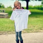 Tyler Baltierra Instagram – Painted face & nails with beads in her hair & on her wrists! This little girl had the best time ever at her first sleep away camp & I’m so proud of her! She made so many friends & memories. Her favorite activities were archery & horse riding (of course lol!) She learned a lot of cool skills but the most important one of them all, is that she learned more about the priceless value of inclusion, compassion & empathy for others. Every counselor loved her & told us how kind & caring Novalee was to all of the kids & it just warmed my heart to hear that she is putting the values we have taught her into practice. She cried tears of joy when she saw me & her mom. She leaped into my arms as I picked her up & we just squeezed each other so tight! The time away from her was worth it for that kind of hug let me tell ya! My baby is growing up so fast & she continues to do it with so much grace, courage & love…she inspires me daily & I’m just so proud of her! 🥹❤️😭 #NovaleeReign