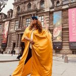 Tyra Banks Instagram - As a teenager, I walked the streets of Paris, going from casting to casting, hoping to get chosen. Cut to decades later… Moments after the @louisvuitton x @kidsuper men’s fashion show, and I have no shame in getting my pose on in front of the @museelouvre rocking a Louis cap Colm gave me and a golden kaftan I picked up from an Abu Dhabi desert hotel gift shop. Every #Paris street is a photo studio. Remember that. 💪🏽🇫🇷📸