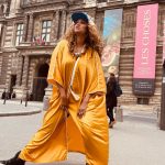 Tyra Banks Instagram - As a teenager, I walked the streets of Paris, going from casting to casting, hoping to get chosen. Cut to decades later… Moments after the @louisvuitton x @kidsuper men’s fashion show, and I have no shame in getting my pose on in front of the @museelouvre rocking a Louis cap Colm gave me and a golden kaftan I picked up from an Abu Dhabi desert hotel gift shop. Every #Paris street is a photo studio. Remember that. 💪🏽🇫🇷📸