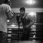 Uus Instagram - Senin gym, selasa boxing, rabu gym, kamis boxing, jumat gym, sabtu rest, minggu jogging 6-8km. No alkohol. One meal a day. Selama hampir 2 bulan. Buat apa sih? Buat rispek sama olah raga ini dan fighter-fighter yg memang nyari nafkah dari sini. Banyak fighter yg kehilangan waktu seneng-seneng, gabisa nikmatin makanan minuman kesukaan, depresi tiap malem sampe gabisa tidur, cuekin sakit badan, bahkan ga punya waktu luang buat sekadar ngobrol sm keluarga. Karena gue bukan fighter kaya mereka, gue minta izin dalem hati sm mereka buat bertanding di olah raga yg mereka cinta. Gue gamau nganggep remeh olah raga yang banyak orang menggantungkan jiwa dan hatinya. Terima kasih boxing untuk mempertemukan gue sm fighter-fighter yang luar biasa humble dan hustle, untuk pukulan yg menyadarkan gue kalo gue selalu lemah makanya gue harus selalu usaha, dan ngebantuin gue sebagai seorang bapak untuk mencoba dan belajar hal baru diumur 30an. Dan siapapun bapak-bapak yang baca tulisan ini, menafkahi keluarga memang sulit, tapi akan lebih sulit ketika menafkahi dalam kondisi hati yg tidak ternafkahi. Semoga bapak-bapak semua menemukan hal yang membuat hati bisa ternafkahi tanpa membebani yg dinafkahi. Terima kasih ya sudah bertahan sejauh ini 🙇 Maap post ulang td potonya ada yg salah 😂 maap maap