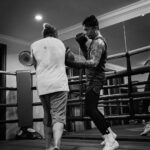 Uus Instagram - Senin gym, selasa boxing, rabu gym, kamis boxing, jumat gym, sabtu rest, minggu jogging 6-8km. No alkohol. One meal a day. Selama hampir 2 bulan. Buat apa sih? Buat rispek sama olah raga ini dan fighter-fighter yg memang nyari nafkah dari sini. Banyak fighter yg kehilangan waktu seneng-seneng, gabisa nikmatin makanan minuman kesukaan, depresi tiap malem sampe gabisa tidur, cuekin sakit badan, bahkan ga punya waktu luang buat sekadar ngobrol sm keluarga. Karena gue bukan fighter kaya mereka, gue minta izin dalem hati sm mereka buat bertanding di olah raga yg mereka cinta. Gue gamau nganggep remeh olah raga yang banyak orang menggantungkan jiwa dan hatinya. Terima kasih boxing untuk mempertemukan gue sm fighter-fighter yang luar biasa humble dan hustle, untuk pukulan yg menyadarkan gue kalo gue selalu lemah makanya gue harus selalu usaha, dan ngebantuin gue sebagai seorang bapak untuk mencoba dan belajar hal baru diumur 30an. Dan siapapun bapak-bapak yang baca tulisan ini, menafkahi keluarga memang sulit, tapi akan lebih sulit ketika menafkahi dalam kondisi hati yg tidak ternafkahi. Semoga bapak-bapak semua menemukan hal yang membuat hati bisa ternafkahi tanpa membebani yg dinafkahi. Terima kasih ya sudah bertahan sejauh ini 🙇 Maap post ulang td potonya ada yg salah 😂 maap maap