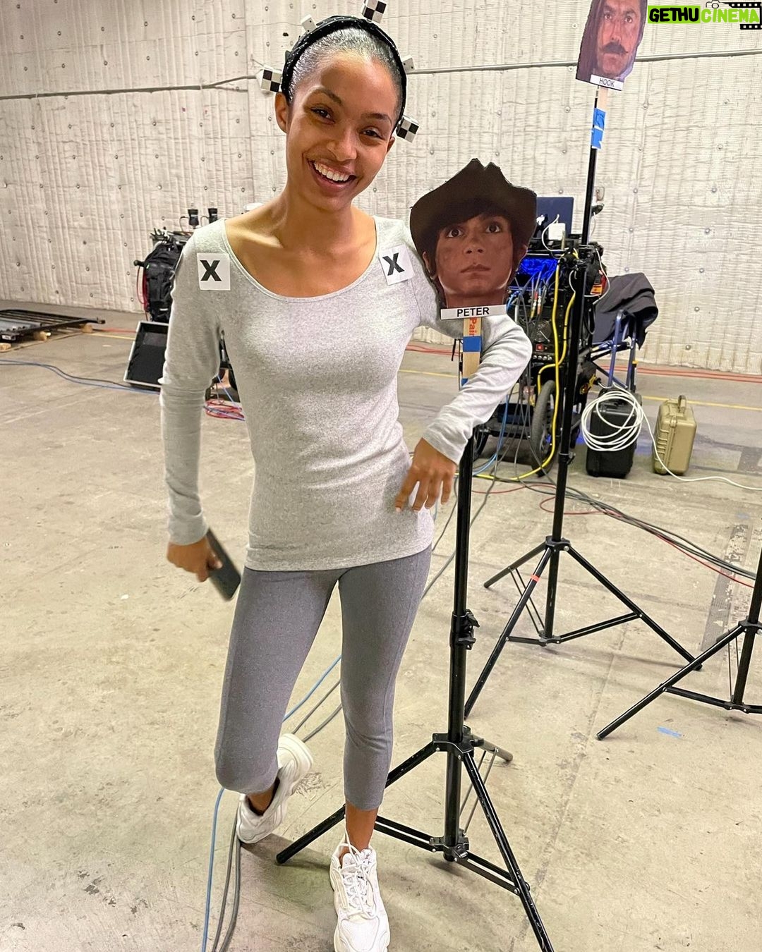 Yara Shahidi Instagram - How it started VS how it’s going ✨🧚🏽♂️ Can you believe we met for the first time … last week ?! It’s been a dream playing Tink to their incredible Peter Pan and Wendy 💚 @disneypeterpan out TOMORROW #PeterPanandWendy #Tinkerbell