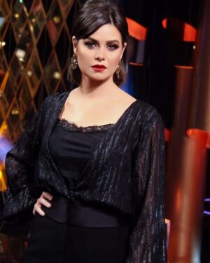 Yosra El Lozy Instagram - From my last TV interview, Styled by @maigalal jumpsuit from the Party Edit 2020 @pronovias by @figeypt 
Make up @monagamalmakeup 
Earrings @js_jewlery_byengyfayad 
Photo credit @mostafa_zidan.7