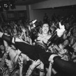 Yungblud Instagram – INSANE! last night we went home to the village where i grew up and put on a rock n roll show. i’ve played shows here since i was 13 years old and dreamt about findin you all. all my family was there, the whole city came out n we even made the fuckin news. lol. it’s places like this that provide music and outlets to express yourself in small communities so we need to keep them alive. this was truly one of the most special days of my life. fank u for celebrating with me. i love you all 🖤☠️💕🖤

	⁃	ps peep the last slide. im 13 yeah. same gig and no one was there 🤣🤣🤣