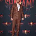 Zachary Levi Instagram - One more for the lewk. 📍🇮🇹 Grooming: @mnmachado Styled by: @warrenalfiebaker Suit: Custom @brooksbrothers Shoes: @louboutinworld Watch: @montblanc Necklace: @movado First photo ©️@marillasicilia/@mondadoriportfolio Photos: @warnerbrosuk @warnerbrosentertainment @shazammovie Rome, Italy