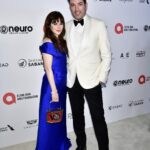 Zooey Deschanel Instagram - Paying tribute to the icon @viviennewestwood at the Elton John AIDS foundation Academy Awards party. ❤️❤️❤️ Styling: @ibabdelnasser Hair: @evaniefrausto Makeup: @missjobaker Dress: @viviennewestwood Shoes: @rogervivier Jewelry: @official_mikimoto Bag: Vintage Schiaparelli