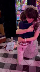 Zooey Deschanel Instagram - When your little guy hugs you for the whole song 🥹 Merry merry, everyone!