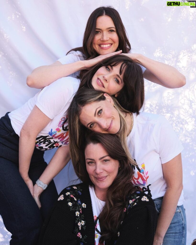 Zooey Deschanel Instagram - Proud to support and be a part of this community of #momsformoms co-founded by one of my best friends @_heartmom_ ❤️ This new #CommUnityMotherhood t-shirt campaign for Mother’s Day supports the @allianceofmoms amazing work to provide critical service, education, resources, and advocacy so that young parents in foster care and their children can heal and thrive! And it is available now on shopallianceofmoms.org ✨