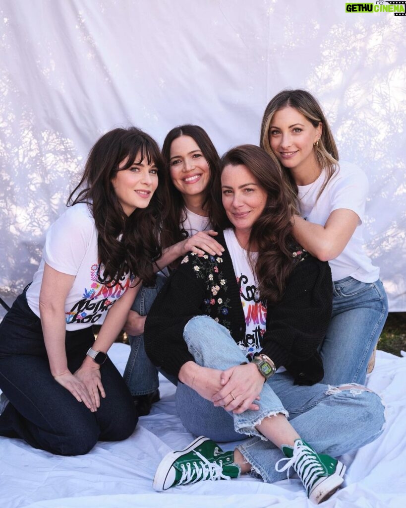 Zooey Deschanel Instagram - Proud to support and be a part of this community of #momsformoms co-founded by one of my best friends @_heartmom_ ❤️ This new #CommUnityMotherhood t-shirt campaign for Mother’s Day supports the @allianceofmoms amazing work to provide critical service, education, resources, and advocacy so that young parents in foster care and their children can heal and thrive! And it is available now on shopallianceofmoms.org ✨