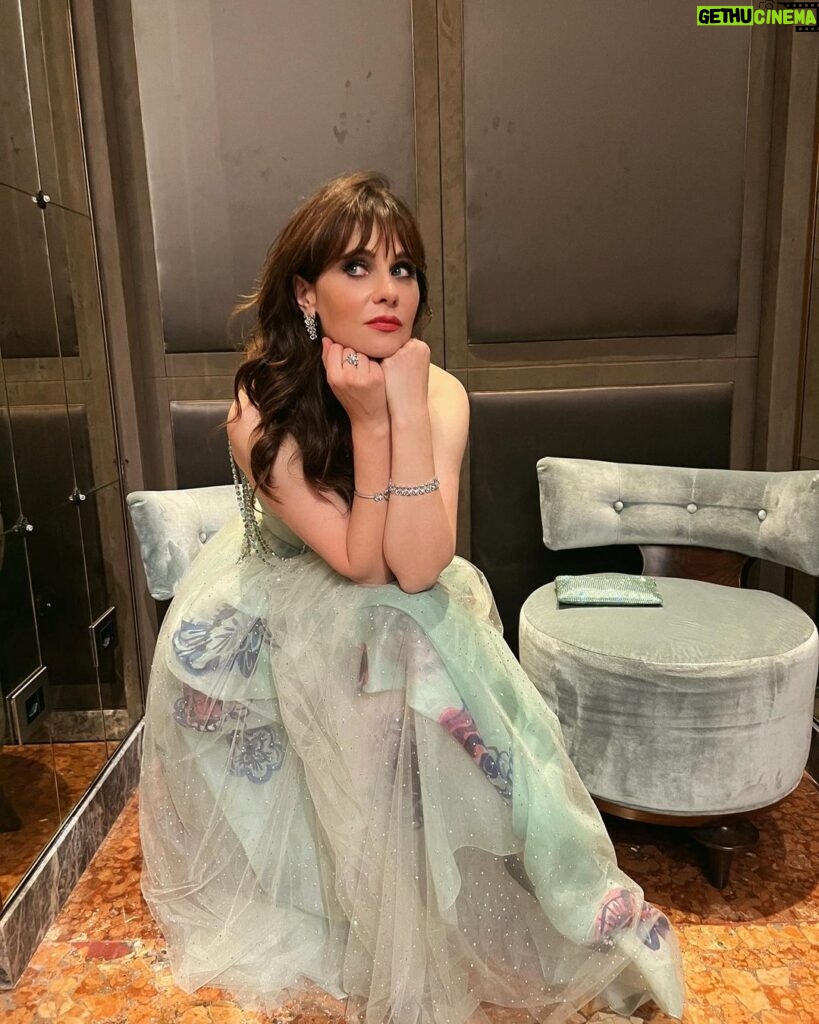Zooey Deschanel Instagram - Accidentally matched the chairs, intentionally took a picture 💗 Jewels by @bulgari Dress by @giorgioarmani Privé Thank you @vanityfairitalia ✨