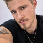 Alexander Ludwig Instagram - @theirisours is flying! limited stock and selling out fast so get yours soon! change the game. #Their #recycledgold #sustainablejewerly #futureofheirlooms link in bio Partnership with @onetreeplanted You guys are making this something special that is changing the way we look at how we consume.