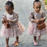 Amara 'La Negra' Instagram - My Little Ladies! @lasroyaltwins So Bougie with There Babies Hermes Purse from @coolkidznyc I’m so In love with them.. Enamorada de Mis Bebés 👧🏽👧🏽 #SumajestadRoyalty #SualtezaEmpress Dress; @rubybellebaby