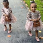 Amara 'La Negra' Instagram - My Little Ladies! @lasroyaltwins So Bougie with There Babies Hermes Purse from @coolkidznyc I’m so In love with them.. Enamorada de Mis Bebés 👧🏽👧🏽 #SumajestadRoyalty #SualtezaEmpress Dress; @rubybellebaby