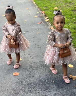 Amara 'La Negra' Instagram - My Little Ladies!  @lasroyaltwins So Bougie with There Babies Hermes Purse from @coolkidznyc I’m so In love with them.. Enamorada de Mis Bebés 👧🏽👧🏽 #SumajestadRoyalty #SualtezaEmpress 
Dress; @rubybellebaby