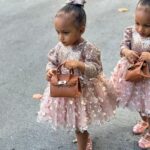 Amara 'La Negra' Instagram - My Little Ladies! @lasroyaltwins So Bougie with There Babies Hermes Purse from @coolkidznyc I’m so In love with them.. Enamorada de Mis Bebés 👧🏽👧🏽 #SumajestadRoyalty #SualtezaEmpress Dress; @rubybellebaby