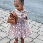 Amara 'La Negra' Instagram - My Little Ladies! @lasroyaltwins So Bougie with There Babies Hermes Purse from @coolkidznyc I’m so In love with them.. Enamorada de Mis Bebés 👧🏽👧🏽 #SumajestadRoyalty #SualtezaEmpress Dress; @rubybellebaby