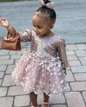 Amara 'La Negra' Instagram - My Little Ladies!  @lasroyaltwins So Bougie with There Babies Hermes Purse from @coolkidznyc I’m so In love with them.. Enamorada de Mis Bebés 👧🏽👧🏽 #SumajestadRoyalty #SualtezaEmpress 
Dress; @rubybellebaby