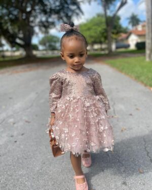 Amara 'La Negra' Instagram - My Little Ladies!  @lasroyaltwins So Bougie with There Babies Hermes Purse from @coolkidznyc I’m so In love with them.. Enamorada de Mis Bebés 👧🏽👧🏽 #SumajestadRoyalty #SualtezaEmpress 
Dress; @rubybellebaby