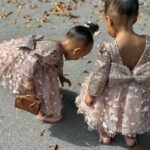 Amara 'La Negra' Instagram - My Little Ladies! @lasroyaltwins So Bougie with There Babies Hermes Purse from @coolkidznyc I’m so In love with them.. Enamorada de Mis Bebés 👧🏽👧🏽 #SumajestadRoyalty #SualtezaEmpress Dress; @rubybellebaby