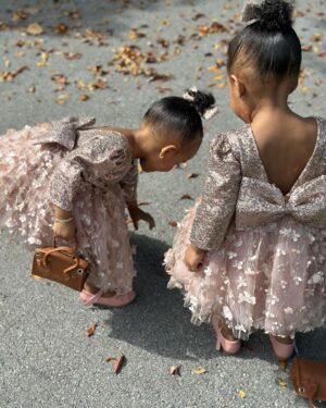 Amara 'La Negra' Instagram - My Little Ladies!  @lasroyaltwins So Bougie with There Babies Hermes Purse from @coolkidznyc I’m so In love with them.. Enamorada de Mis Bebés 👧🏽👧🏽 #SumajestadRoyalty #SualtezaEmpress 
Dress; @rubybellebaby