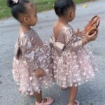 Amara 'La Negra' Instagram - My Little Ladies! @lasroyaltwins So Bougie with There Babies Hermes Purse from @coolkidznyc I’m so In love with them.. Enamorada de Mis Bebés 👧🏽👧🏽 #SumajestadRoyalty #SualtezaEmpress Dress; @rubybellebaby
