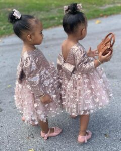 Amara 'La Negra' Instagram - My Little Ladies! @lasroyaltwins So Bougie with There Babies Hermes Purse from @coolkidznyc I’m so In love with them.. Enamorada de Mis Bebés 👧🏽👧🏽 #SumajestadRoyalty #SualtezaEmpress Dress; @rubybellebaby