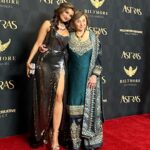 Anjali Bhimani Instagram – Having the two most important people in my world on the red carpet at the Astra Awards was the best award I could ask for. (Swipe all the way to the end to see Mom being extra adorable and cracking us up.) Thanks to the @hollywoodcreativealliance for always throwing a wonderful celebration and for giving me the chance to drag my mom on the carpet to show the world she is a queen and knows how to dress like one too. More photo dumps to come! 

Styling: @melvinstyles 
Dress: @beeombi 
Glam: @michelle.borbolla Los Angeles, California