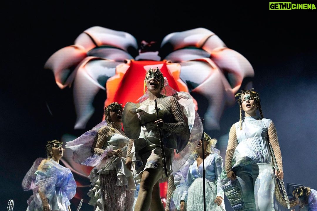 Björk Instagram - thanks for tonight bologna! musicians : @viibraflutes @bergurth @manudelagomusic @katiebuckleyharpist bjork outfit @robertwun headpieces @james.t.merry lace bodysuit @sarahregensburger_official shoes @melissaofficial x victor & rolf sphaera dress @irisvanherpen musicians outfits @balmain hair pieces @tomikono_wig makeup @andrewgallimakeup styling @eddagud photos @santiagraphy Bologna, Italy
