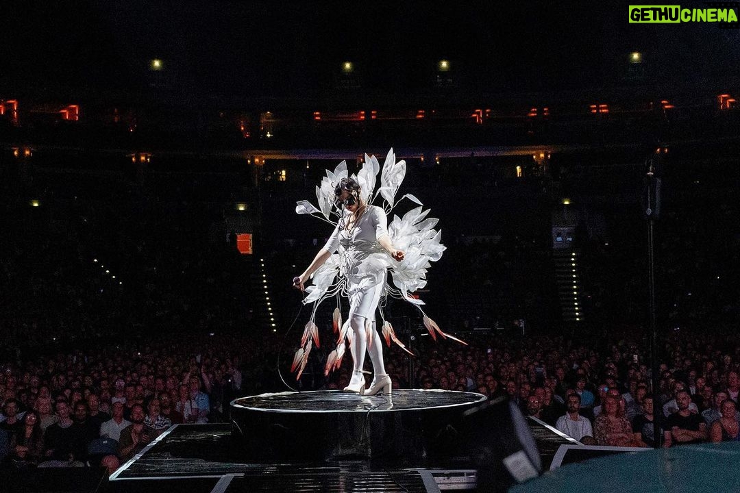Björk Instagram - thanks for tonight prague! musicians : @viibraflutes @bergurth @manudelagomusic @katiebuckleyharpist bjork outfit @babbym headpieces @james.t.merry boots @driesvannoten sphaera dress @irisvanherpen musicians outfits @balmain hair pieces @tomikono_wig makeup @isshehungry styling @eddagud photos @santiagraphy Prague, Czech Republic