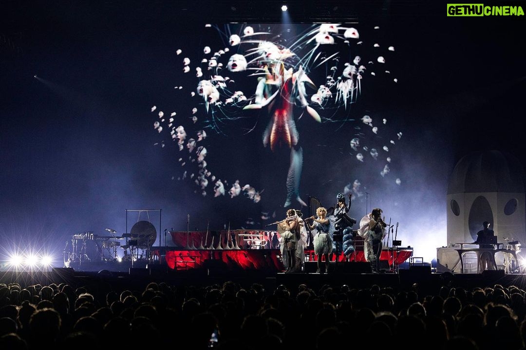 Björk Instagram - thank you milan for a magnificent evening ! musicians : @viibraflutes @bergurth @manudelagomusic @katiebuckleyharpist bjork outfit @bnnttclay.labs @bnnttclay hat @sanchez_kane headpieces @james.t.merry boots @driesvannoten encore sphaera dress @irisvanherpen musicians outfits @balmain hair pieces @tomikono_wig makeup @isshehungry styling @eddagud photos @santiagraphy