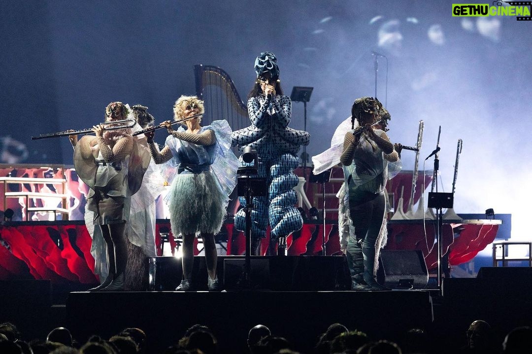 Björk Instagram - thank you milan for a magnificent evening ! musicians : @viibraflutes @bergurth @manudelagomusic @katiebuckleyharpist bjork outfit @bnnttclay.labs @bnnttclay hat @sanchez_kane headpieces @james.t.merry boots @driesvannoten encore sphaera dress @irisvanherpen musicians outfits @balmain hair pieces @tomikono_wig makeup @isshehungry styling @eddagud photos @santiagraphy