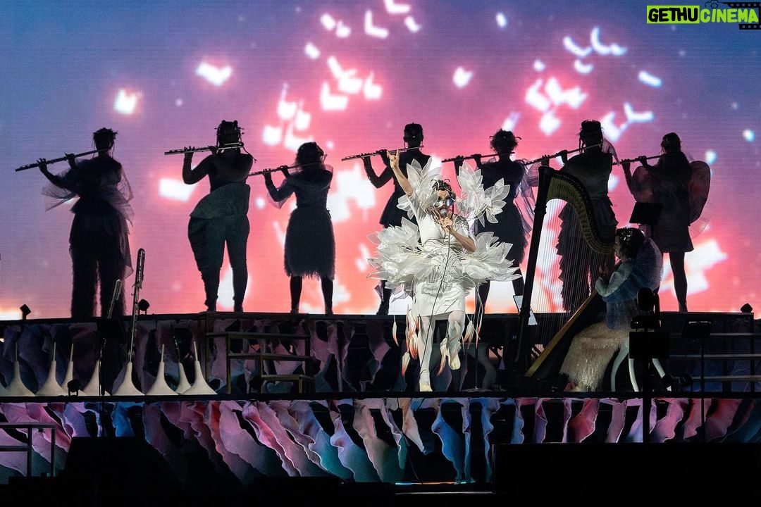 Björk Instagram - thank you milan for a magnificent evening ! musicians : @viibraflutes @bergurth @manudelagomusic @katiebuckleyharpist bjork outfit @bnnttclay.labs @bnnttclay hat @sanchez_kane headpieces @james.t.merry boots @driesvannoten encore sphaera dress @irisvanherpen musicians outfits @balmain hair pieces @tomikono_wig makeup @isshehungry styling @eddagud photos @santiagraphy