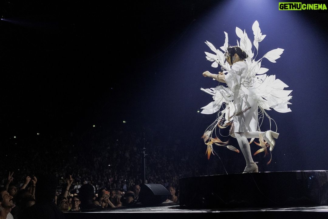 Björk Instagram - thank you paris for a spectacular evening ! musicians : @viibraflutes @bergurth @manudelagomusic @katiebuckleyharpist bjork dress @jisoobaikparis anthurium flower @loewe headpieces @james.t.merry shoes @maisonmargiela encore outfit @irisvanherpen musicians outfits @balmain hair pieces @tomikono_wig makeup @isshehungry styling @eddagud photos @santiagraphy