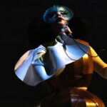 Björk Instagram - thanks for tonight Leipzig! musicians : @viibraflutes @bergurth @manudelagomusic @katiebuckleyharpist bjork wood sculpture outfit @zomer.official @xylomancia_ dress @kwkbykaykwok headpieces @james.t.merry sphæra dress @irisvanherpen musicians outfits @balmain hair @johnvialhair musicians hair @tomikono_wig makeup @isshehungry styling @eddagud photos @santiagraphy Leipzig, Germany